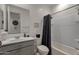 Clean bathroom with neutral tones featuring a shower over tub and a vanity sink at 36243 W San Clemente Ave, Maricopa, AZ 85138