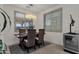 Elegant dining area features stylish lighting and comfortable seating for Gathering meals at 36243 W San Clemente Ave, Maricopa, AZ 85138