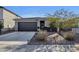 Charming single story home with a two car garage, landscaped yard, and cozy front entrance at 36243 W San Clemente Ave, Maricopa, AZ 85138