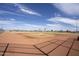 This baseball field offers a fantastic outdoor recreational space with well-maintained grounds under a bright blue sky at 40789 W Shaver Dr, Maricopa, AZ 85138