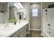 This bathroom features double sinks, modern fixtures, and a shower/tub combo, offering both style and functionality at 40789 W Shaver Dr, Maricopa, AZ 85138