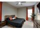 Spacious bedroom featuring plush carpet and a large window at 40789 W Shaver Dr, Maricopa, AZ 85138