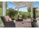 Relaxing backyard patio featuring comfortable seating and a pergola for shade on sunny days at 4297 S Marion Pl, Chandler, AZ 85249