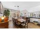 Charming dining room featuring a large wooden table and chairs, creating a warm and inviting space at 4297 S Marion Pl, Chandler, AZ 85249