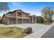 Stunning front exterior view of the house, highlighting its architectural details, landscaping, and curb appeal at 4297 S Marion Pl, Chandler, AZ 85249