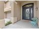 Inviting front entrance with a decorative steel door, elegant sidelights, and a welcoming porch at 4297 S Marion Pl, Chandler, AZ 85249