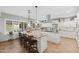 Bright kitchen featuring white cabinets, stainless steel appliances, and a center island with bar seating at 4297 S Marion Pl, Chandler, AZ 85249