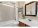 Bathroom features a shower and tub combination with a single sink vanity at 4483 E Sourwood Dr, Gilbert, AZ 85298