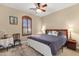 This bedroom has a ceiling fan, wood blinds, and neutral walls at 4483 E Sourwood Dr, Gilbert, AZ 85298