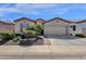 Charming home with a two car garage, desert landscaping, and a brick paver walkway at 4483 E Sourwood Dr, Gilbert, AZ 85298