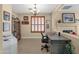 Home office with decorative fireplace, wood floor, and natural light for a comfortable workspace at 4483 E Sourwood Dr, Gilbert, AZ 85298