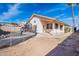 View of a backyard with a pool and covered patio at 5125 W Wikieup Ln, Glendale, AZ 85308