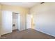 Modest bedroom with closet and ensuite bathroom, ready for personal touches at 5125 W Wikieup Ln, Glendale, AZ 85308