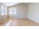 Bright bedroom with tile floors, neutral walls, and large windows providing ample natural light at 5125 W Wikieup Ln, Glendale, AZ 85308