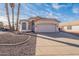 Charming single Gathering home with desert landscaping and attached two car garage at 5125 W Wikieup Ln, Glendale, AZ 85308