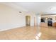 Bright living room features vaulted ceilings, tile flooring, and easy access to kitchen at 5125 W Wikieup Ln, Glendale, AZ 85308