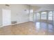 Spacious and open living room featuring tile flooring and lots of natural light at 5125 W Wikieup Ln, Glendale, AZ 85308