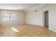 Open living room featuring vaulted ceilings, neutral walls, and tile flooring throughout at 5125 W Wikieup Ln, Glendale, AZ 85308