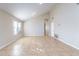 Bright living room featuring vaulted ceilings, tile flooring, and neutral colors at 5125 W Wikieup Ln, Glendale, AZ 85308