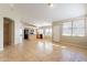 Spacious living room offers tile flooring, natural light, and an open floor plan at 5125 W Wikieup Ln, Glendale, AZ 85308