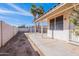 View of back patio, house, and the block wall at 5125 W Wikieup Ln, Glendale, AZ 85308