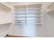 Interior shot of a well-organized walk-in closet with built-in shelving at 5125 W Wikieup Ln, Glendale, AZ 85308