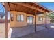 Covered patio area extending from the house, perfect for outdoor dining and relaxation at 516 E Mesquite Ave, Apache Junction, AZ 85119