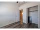 Bedroom featuring wood floors, closet, ceiling fan and natural light at 516 E Mesquite Ave, Apache Junction, AZ 85119