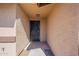 A close-up of the home's front door with adjacent stucco wall at 516 E Mesquite Ave, Apache Junction, AZ 85119