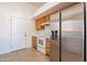 Cozy kitchen featuring wooden cabinets and modern stainless steel refrigerator appliance at 516 E Mesquite Ave, Apache Junction, AZ 85119