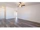 Open living room with modern wood flooring and ceiling fan at 516 E Mesquite Ave, Apache Junction, AZ 85119