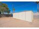 Large white storage shed in backyard, with plenty of room for tools and equipment at 516 E Mesquite Ave, Apache Junction, AZ 85119