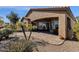 Charming backyard retreat features a covered patio, brick pavers, and lush desert landscaping at 5165 S Peach Willow Ln, Gilbert, AZ 85298