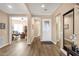 Bright entryway features wood-look floors and neutral paint. There is a large mirror on the right-hand wall at 5165 S Peach Willow Ln, Gilbert, AZ 85298