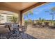 Enjoy outdoor dining on this covered patio, complete with a built-in grill and views of the lush golf course at 5165 S Peach Willow Ln, Gilbert, AZ 85298