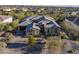 Stunning aerial view of a luxury home with meticulous landscaping and a private driveway at 5421 E Juniper Canyon Dr, Cave Creek, AZ 85331