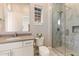 Well-lit bathroom with white vanity, quartz countertop, decorative mirror, and glass enclosed tiled shower at 5421 E Juniper Canyon Dr, Cave Creek, AZ 85331