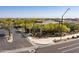 View of the upscale 'Bellisima' gated community entrance, surrounded by desert landscaping and mature trees at 5421 E Juniper Canyon Dr, Cave Creek, AZ 85331