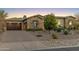 Charming single-Gathering home with stone accents, three-car garage, well manicured landscaping and paver driveway at 5421 E Juniper Canyon Dr, Cave Creek, AZ 85331