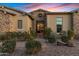 Attractive front entrance featuring stone details, desert landscaping, and a paver walkway, creating curb appeal at 5421 E Juniper Canyon Dr, Cave Creek, AZ 85331