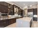 This modern kitchen features sleek cabinetry, a large center island, and stainless steel appliances at 5421 E Juniper Canyon Dr, Cave Creek, AZ 85331