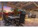 Charming outdoor dining area under a pergola with string lights, perfect for cozy evenings at 5421 E Juniper Canyon Dr, Cave Creek, AZ 85331