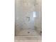 Walk-in shower with sleek glass door, tiled walls, and modern fixtures in a contemporary bathroom at 5421 E Juniper Canyon Dr, Cave Creek, AZ 85331