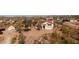 Aerial view of a charming home with a red tile roof on a spacious desert lot at 5556 E Singletree St, Apache Junction, AZ 85119