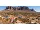 Expansive aerial view of a desert neighborhood with stunning mountain backdrops at 5556 E Singletree St, Apache Junction, AZ 85119