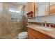 Bathroom featuring a tiled walk-in shower, vanity with stone countertops, and modern fixtures at 5556 E Singletree St, Apache Junction, AZ 85119