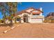 Charming single Gathering home featuring a tile roof, desert landscaping, and a two car garage at 5556 E Singletree St, Apache Junction, AZ 85119