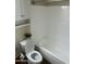 Bathroom featuring a white bathtub with tiled walls and a toilet with a storage cabinet above at 5995 N 78Th St # 2026, Scottsdale, AZ 85250