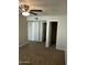 Bedroom featuring carpet, closet space, and fan at 5995 N 78Th St # 2026, Scottsdale, AZ 85250