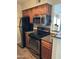 Kitchen with modern appliances, granite countertops and wood cabinets at 5995 N 78Th St # 2026, Scottsdale, AZ 85250